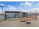Covered horse stall with hay bales, sturdy fencing, and desert backdrop at 11875 Maggie Ave, Las Vegas, NV 89166