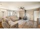 Cozy living room with wood burning stove, ceiling fan, and comfortable sofas at 11875 Maggie Ave, Las Vegas, NV 89166