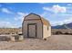 Outdoor shed with a brown roof and beige siding at 11875 Maggie Ave, Las Vegas, NV 89166