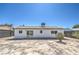 Back exterior view with a sliding glass door leading to the yard at 4012 Mira Ln, Las Vegas, NV 89108