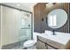 Stylish bathroom featuring modern vanity, round mirror, and glass-enclosed shower at 4012 Mira Ln, Las Vegas, NV 89108