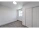 Bright bedroom with gray carpeting, a window, and a double-door closet at 4012 Mira Ln, Las Vegas, NV 89108