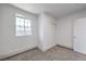 Bright bedroom with a window, closet, new carpet, and fresh paint at 4012 Mira Ln, Las Vegas, NV 89108