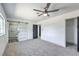 Bedroom featuring a stylish barn door to bathroom with sleek glass shower at 4012 Mira Ln, Las Vegas, NV 89108