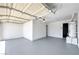 Spacious garage with epoxy flooring, water heater, and plenty of room for parking at 4012 Mira Ln, Las Vegas, NV 89108