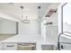 Bright kitchen features breakfast bar with marble countertop and wood shelving at 4012 Mira Ln, Las Vegas, NV 89108