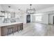 Bright, open-concept kitchen features a breakfast bar that opens up to the living area at 4012 Mira Ln, Las Vegas, NV 89108