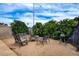 Backyard with outdoor seating area and lush landscaping at 4578 Churchfield Cir, Las Vegas, NV 89103