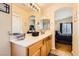 Updated bathroom with large mirror and adjoining bedroom at 5536 Baccarat Ave # 101, Las Vegas, NV 89122