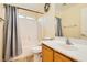 Well-lit bathroom featuring a shower-tub combo with a gray shower curtain at 5536 Baccarat Ave # 101, Las Vegas, NV 89122