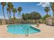 Enjoy the large community pool surrounded by palm trees, offering a relaxing oasis at 5536 Baccarat Ave # 101, Las Vegas, NV 89122