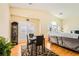 Dining room with marble table, hardwood floors, and a stylish display cabinet at 5536 Baccarat Ave # 101, Las Vegas, NV 89122
