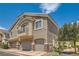 Well-maintained exterior view of a two-story townhome, showing garage and balcony at 5536 Baccarat Ave # 101, Las Vegas, NV 89122