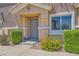 Welcoming front entrance with mature landscaping and a secure ADT system at 5536 Baccarat Ave # 101, Las Vegas, NV 89122