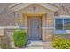 Charming front entrance with well-maintained landscaping and a secure ADT system for peace of mind at 5536 Baccarat Ave # 101, Las Vegas, NV 89122