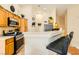 Kitchen with breakfast bar, stainless steel appliances and charming decor at 5536 Baccarat Ave # 101, Las Vegas, NV 89122