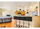 Open floor plan showcasing the breakfast bar, connecting the kitchen and living areas at 5536 Baccarat Ave # 101, Las Vegas, NV 89122