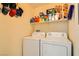 Laundry room featuring washer and dryer units and stocked shelves at 5536 Baccarat Ave # 101, Las Vegas, NV 89122