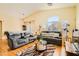 Inviting living room features vaulted ceilings, hardwood floors, and stylish contemporary decor at 5536 Baccarat Ave # 101, Las Vegas, NV 89122