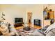 Open living room with hardwood floors, entertainment center, and modern furnishings at 5536 Baccarat Ave # 101, Las Vegas, NV 89122