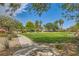 Serene community park with walking paths, mature trees, and green spaces for outdoor enjoyment at 5536 Baccarat Ave # 101, Las Vegas, NV 89122