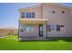 Backyard with an open patio and well-maintained artificial turf offering a great outdoor space at 6294 Redstone Hills Dr, Las Vegas, NV 89148