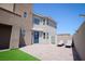 Low maintenance backyard with blue door, hardscape and artificial turf, featuring lounge chairs at 6294 Redstone Hills Dr, Las Vegas, NV 89148