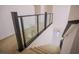 Carpeted staircase features modern railing with glass inserts leading to the second level at 6294 Redstone Hills Dr, Las Vegas, NV 89148