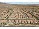 Vast residential area filled with houses, a winding road, and orderly neighborhood layout at 8107 Skye Sweep St, Las Vegas, NV 89166