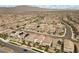 A neighborhood view showcases similar-style houses, streets, and well-kept landscapes under a bright sky at 8107 Skye Sweep St, Las Vegas, NV 89166