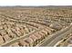 Planned community shows many houses set along curving streets, creating a dense but organized residential area at 8107 Skye Sweep St, Las Vegas, NV 89166