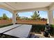 Relaxing covered back patio featuring a hot tub and views of the community at 8107 Skye Sweep St, Las Vegas, NV 89166