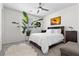 Cozy bedroom with modern ceiling fan and ample natural light at 8107 Skye Sweep St, Las Vegas, NV 89166