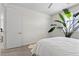 Bright bedroom featuring a large window and plant accents at 8107 Skye Sweep St, Las Vegas, NV 89166