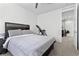 Neutral bedroom with natural lighting, carpet flooring, and minimalistic decor at 8107 Skye Sweep St, Las Vegas, NV 89166