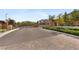 Gated community entrance ensuring privacy and security for residents with paved streets and landscaping at 8107 Skye Sweep St, Las Vegas, NV 89166