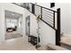 Bright entryway boasts modern staircase, coat rack, and convenient bench seating at 8107 Skye Sweep St, Las Vegas, NV 89166