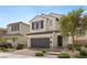 Charming two-story home featuring a well-manicured front yard and a neutral color palette at 8107 Skye Sweep St, Las Vegas, NV 89166