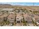Beautiful homes in a suburban neighborhood with garages, driveways, and well-maintained front yards at 8107 Skye Sweep St, Las Vegas, NV 89166