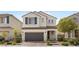 Charming two-story home with a well-maintained lawn and a spacious two car garage at 8107 Skye Sweep St, Las Vegas, NV 89166
