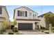 Inviting two-story home featuring neutral stucco, tile roof, shutters and a convenient two car garage at 8107 Skye Sweep St, Las Vegas, NV 89166