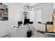 Bright office space featuring built-in shelving, large window, and contemporary light fixture at 8107 Skye Sweep St, Las Vegas, NV 89166