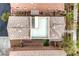 Aerial rooftop view showing a private outdoor living space with patio furniture and desert landscaping at 10085 S Riley St, Las Vegas, NV 89178