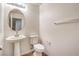 Powder room with a stylish pedestal sink and modern fixtures at 10085 S Riley St, Las Vegas, NV 89178