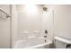 Bright bathroom featuring a white tiled tub and shower at 10085 S Riley St, Las Vegas, NV 89178