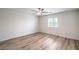 Bright bedroom features wood-look floors and a ceiling fan at 10085 S Riley St, Las Vegas, NV 89178
