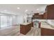 Modern kitchen with stainless steel appliances, granite countertops, and a large island at 10085 S Riley St, Las Vegas, NV 89178