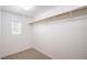 Walk-in closet with shelving and a window for natural light at 10085 S Riley St, Las Vegas, NV 89178
