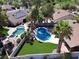 Aerial view of the home with a sparkling pool, jacuzzi, and lush landscaping at 2022 Big Bend Way, Henderson, NV 89074