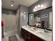 Bathroom with double vanity, shower, and modern lighting creates a functional space at 2022 Big Bend Way, Henderson, NV 89074